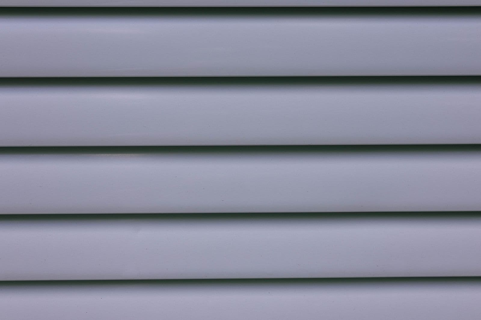 Close view of gray horizontal siding panels